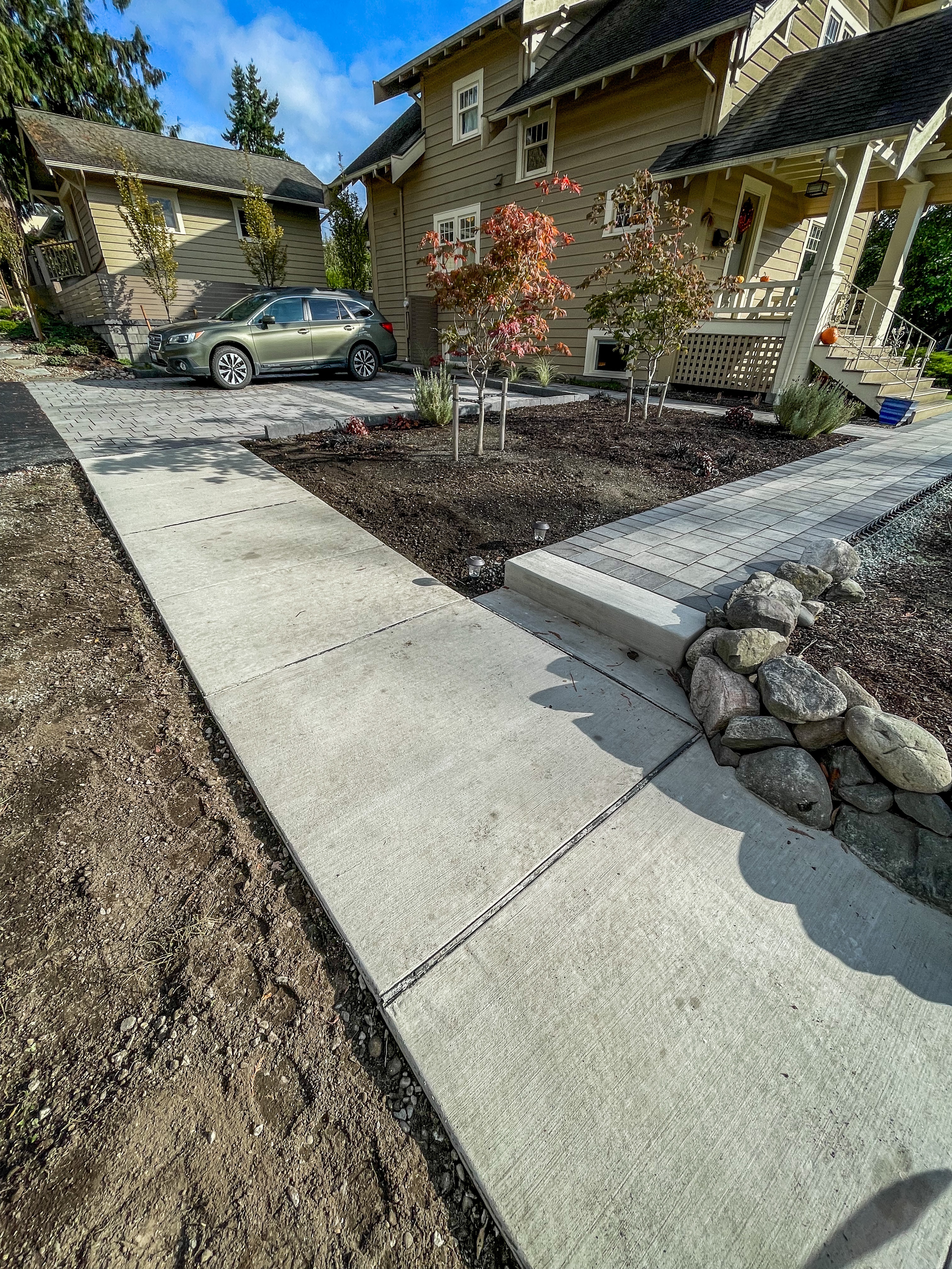 Asphalt Driveway & Concrete Sidewalk
